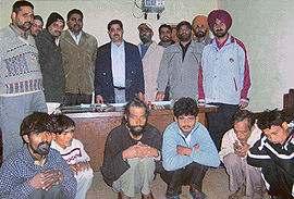 The CIA staff with six members of a gang of robbers