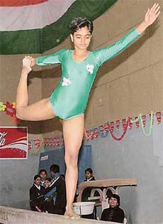 A gymnast on the balancing beam during the 44th Senior National Gymnastics Championship in Mohali