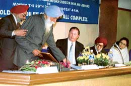 Punjabi scholar Prof Pritam Singh being honoured by Dr Marshal R. Goodman