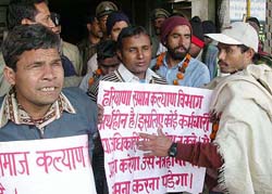 Blind picketers in front of the Haryana Social Justice and Empowerment Department in Chandigarh on Monday.