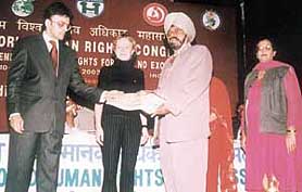 Mr Inderjit Singh, Principal, S. Amar Singh Sher-I-Punjab Pindai Gheb Khalsa Senior Secondary School, receives the prestigious World Human Rights Promotion Award-2003
