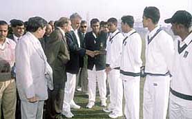 Haryana Vidhan Sabha Deputy Speaker Gopichand Gehlot spins the toss before the opening match of the Commonwealth Under-19 Cricket Championship at the Devi Lal Stadium, Gurgaon on Monday.