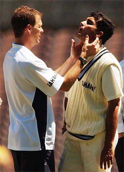 Indian captain Sourav Ganguly has a trainer check his condition after he was struck in the head by Australian pacer Brad Williams