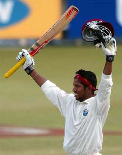 West Indies batsman Ramnaresh Sarwan celebrates his century on the fourth day of the second Test 