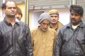 Raghubir Singh with his son Vikram and one of the killers, Pankaj, who was hired by the former to end an incestuous relationship in the family. 