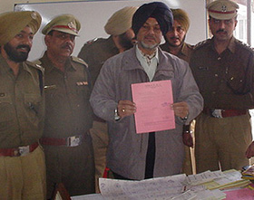 SSP Narinderpal Singh shows fake documents to mediapersons in Ludhiana on Tuesday.