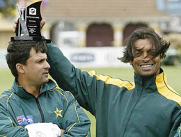 Pakistan's Shoaib Akhtar, declared the man of the match, celebrates with Moin Khan after beating New Zealand in the second Test