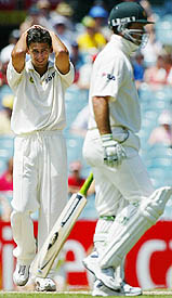 Ajit Agarkar reacts after Australia�s Ricky Ponting was nearly run out during the final day of the third Test at Melbourne.