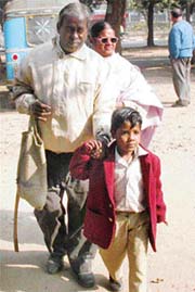 Six-year-old Pawan helps his physically challenged parents to reach the venue of demonstration