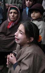 Family members of a person injured in a blast wail in Srinagar on Thursday.