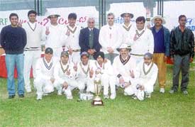 The BL Kashyap team, who annexed the Turf Twenty Cup Cricket Trophy, with Modern School physical education director V K Baweja