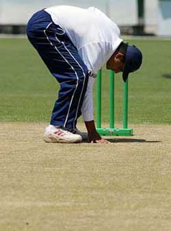 Captain Sourav Ganguly inspects the pitch at the Sydney Cricket Ground on the eve of the fourth and final Test