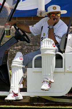 Virender Sehwag sits on a cart as he watches teammates bat in the nets at the Sydney Cricket Ground 