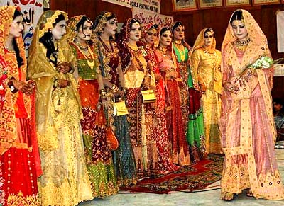 Women take part in a bridal dress show to celebrate New Year in Multan