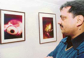 Ashok Kaushal with his photographs on display at IndusInd Art Gallery in Sector 8, Chandigarh
