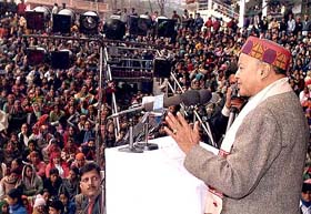 Chief Minister Virbhadra Singh addresses a public gathering on the opening day of Five Day's Winter Carnival 2004 at Manali