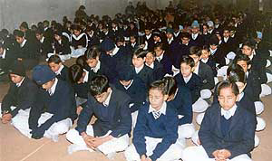 Schoolchildren meditate during Gurpurb celebrations at Sanatan Dharam Vidya Mandir SS School in Ludhiana on Saturday.