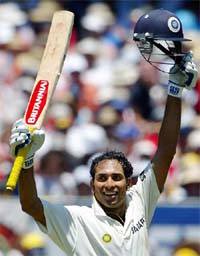 V.V.S. Laxman celebrates after completing his century on the second day of the fourth Test against Australia
