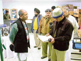 Policemen conduct investigation after a theft at SC0 307, Sector 35 B, in Chandigarh