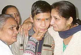 Manik being hugged by relatives after he reached home in Sector 37 in Chandigarh