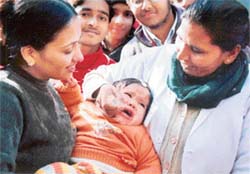 A health worker administers polio drops to a child in Ludhiana on Sunday