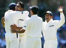 Indian captain Sourav Ganguly celebrates the dismissal of Australia's Matthew Hayden with tem-mates Anil Kumble and Sachin Tendulkar 