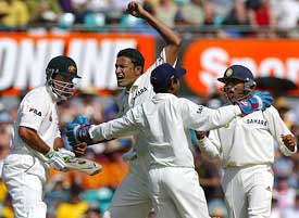 Anil Kumble celebrates with team-mates Parthiv Patel and Akash Chopra after dismissing Australia�s Ricky Ponting 
