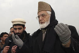 APHC chairman Syed Ali Shah Geelani offers prayers along with his supporters at the martyrs� graveyard in Srinagar on Monday