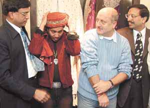 Singer Mikka and Bollywood actor Anupum Kher during the opening of the third mall, �P.P.Design Estate�, with the owners of the showroom at Green Park in the Capital