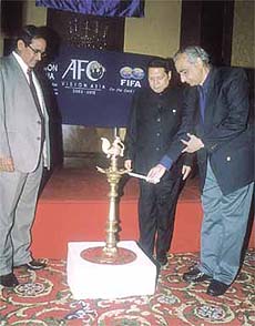Union Minister of Youth Affairs and Sports Vikram Verma, watched by Asian Football Confederation secretary-general Peter Velappan and All India Football Federation president P R Dasmunshi, lighting a lamp to inaugurate the �Vision Asia� Football Conference in the Capital