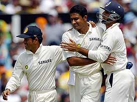 Anil Kumble celebrates with team-mates Akash Chopra and Sachin Tendulkar after taking eight wickets on the fourth day of the fourth Test against Australia 