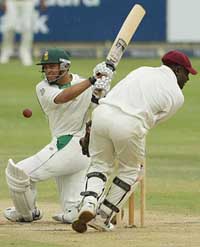 South African batsman Jacques Kallis sweeps the ball past West Indies wicketkeeper Ridley Jacobs 