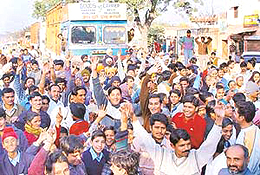 Residents of Mubarikpur village and members of the Patiala unit of the Nepali Jan Adhikar Suraksha Samiti, Bharat, block the busy Ramgarh-Dera Bassi road adjacent to the office of the Deputy Superintendent of Police in Mubarikpur village
