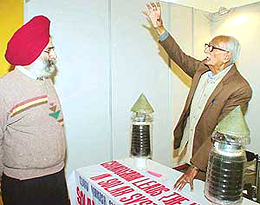 Mr Suraj Parkash Sharma explains a point to a visitor at his stall at the Pride of India exhibition at the Indian Science Congress on the Panjab University campus in Chandigarh on Tuesday. 