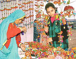 A Gujarati village woman markets her delightful creation during the Gram Shree Mela, which opened at HUDA Grounds in Sector 5, Panchkula, here today.