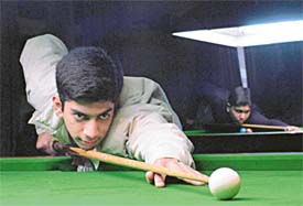 Top seed Dhruv Verma plays a shot in the Punjab State Open Snooker Championship being held in Ludhiana