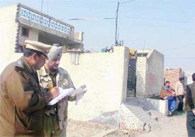 Police officials discuss possible causes that led to the murder of a woman near Mundian village 