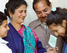 The winner of the first prize of the Punjab Maa Lakshmi Divali and Pooja Bumper lottery draw, Mrs Anita Rani, shares a happy moment with her family members after receiving a cheque of Rs 1.05 crore in Chandigarh