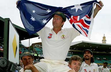 Steve Waugh is carried off the ground by team-mate Matthew Hayden (L) and team trainer Errol Alcott  for the final time, as Jason Gillespie looks on
