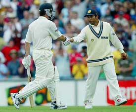 Sachin Tendulkar shakes hand with Steve Waugh after taking Waugh's catch to dismiss him for the last time