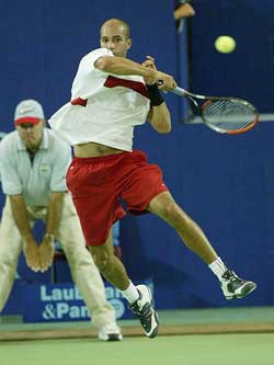 James Blake of the US leaps in the air to play a shot against Jiri Novak of the Czech Republic 