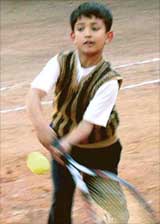 Digvijay Singh returns a backhand shot in the under-12 section of the Total Tennis championship