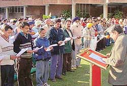 Mr Lalit Sharma, Adviser to the Administrator, administers the oath to the newly elected sarpanches and panches