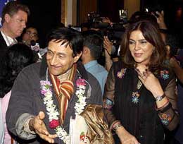 Veteran film star Dev Anand with Zeenat Aman after receiving the Indo-American Society felicitation in Mumbai on Tuesday.