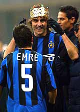 Inter Milan's Christian Vieri wears a crown as he celebrates with team-mate Belozogolu Emre after scoring against Lecce during their Serie A soccer match in Milan 