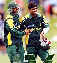 Yousuf Youhana is congratulated by Shoaib Malik after he scored unbeaten 88 in the second one-day match at Queenstown on Wednesday