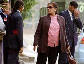 Sri Lanka�s President Chandrika Kumaratunga goes shopping while surrounded by security officials in Islamabad 