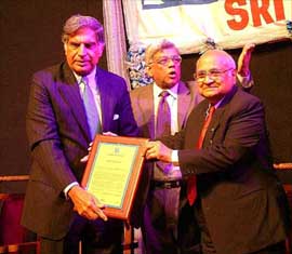 Chairman of the Tata group Ratan Tata receives the 'Sankara Ratna' award from B. R. Barwale, chairman of Mahyco, in Mumbai 