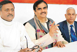 Mr Om Prakash Dhankad, national secretary of the BJP, addresses a press conference at Sector 33, Chandigarh, on Thursday. 