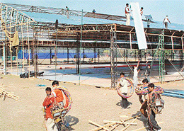 Labourers dismantle the hangar installed for hosting the Indian Science Congress at Panjab University,